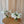 White, green and blush flowers in clear cocktail vase
