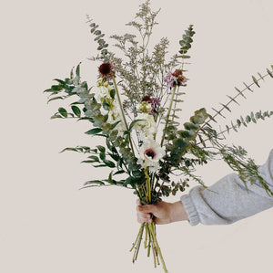Wild textured bouquet with baby blue eucalpytus, limonium filler, anemone and scabiosa