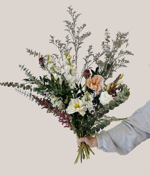 Wild textured bouquet with baby blue eucalpytus, limonium filler, anemone and scabiosa and poppies